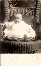RPPC Baby with Long Nose in Wicker Chair Photo Postcard Z3 - $8.95