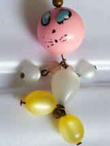 VTG Lucite pink white yellow beads  figurine pendant - £23.81 GBP