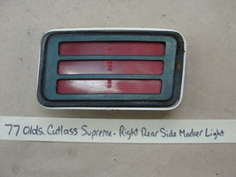 OEM 77 Olds Cutlass Supreme RIGHT REAR SIDE MARKER LIGHT RED LENS BEZEL ... - $29.69