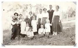 Old photo of a large family standing in a field RPPC Postcard  - £11.55 GBP