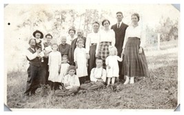 Old photo of a large family standing in a field RPPC Postcard  - £11.13 GBP