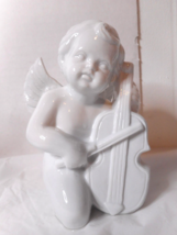 Baby Faced White Ceramic Spread Out Wings Kneeling Playing Cello Hollow 5 5/8&quot; - £17.16 GBP