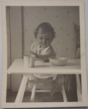  Thirsty Baby Girl In Highchair Reaching For Her Cup Black &amp; White Photo 1950s - $3.99