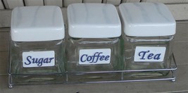 Nice NEW IN BOX Countertops Pantry 4 Piece Glass and Chrome Canister Set... - $14.84