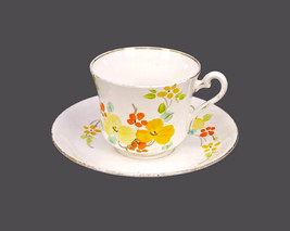 Phoenix Bone China cup and saucer made in England. Orange flowers. Flaws. - $61.02