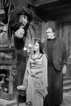 The Munsters Grandpa upside down greeting Herman &amp; Lily in hallway 18x24 poster - £23.53 GBP