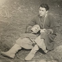 Man Playing Stringer Guitar Like Insturment sitting Found Black and White Photo - £6.36 GBP