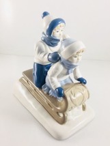FIGURINE GIRL AND BOY ON SLED BLUE AND WHITE PORCELANA DE CUERMAVACA MEXICO - $14.82