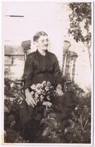 Postcard RPPC Elderly Lady Rocking Chair Garden Flowers - £7.77 GBP