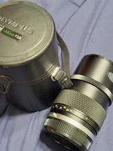 The Olympus/Zuiko 135mm telephoto lens.C.1986 - $30.00