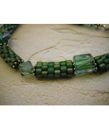 Bracelet: Green Beaded Beads, Swarovski Crystals, Furnace Glass, Sterling Silver - $30.00