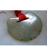 A JADE LOCK IN THE SHAPE OF A RUYI-HEAD. CHINA - $748.96 CAD