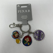 2024 DISNEY PARKS Pixar Up Carl Ellie Grape Soda Metal Flair Keychain Bag Charm - £16.56 GBP