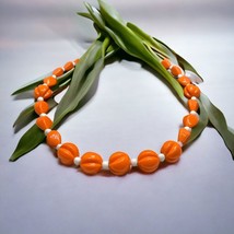 Vintage long lucite orange and white necklace 25” - $442.78 MXN