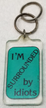 I&#39;m Surrounded by Idiots Keychain Green Black Funny 1980s Plastic Vintage - £9.80 GBP