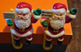 Lot 2 Vintage Plastic Christmas Stocking Holder Elf Santa North Pole Hangers - £10.83 GBP