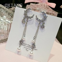 Bedazzled Crescent Moon Drop Earrings - $118.36 MXN