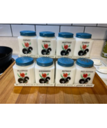  Vintage Tipp USA red flower/black leaf spice jar set of 8 blue lids wit... - $204.43 CAD