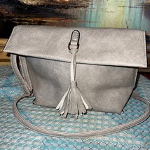 New without tags faux leather/suede purse with tassel detail - $14.70