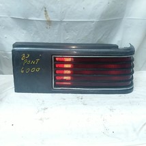 Pontiac 1982-1983 6000 RH Passenger Tail Light Assembly Dark Gray Trim OEM Used - $26.97