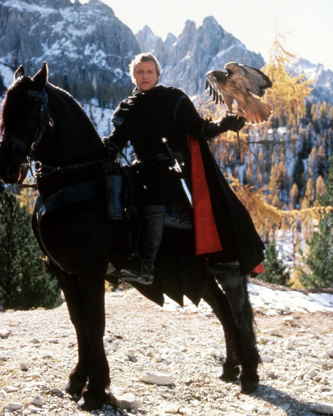 Ladyhawke Rutger Hauer on horse holding hawk by mountains 8x10 Photo