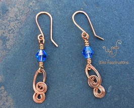 Handmade copper earrings: blue bicone crystal with double spiral dangle - $25.00