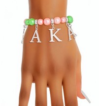 Women&#39;s Pink Green Pearls AKA, Hand Sign, Leaf,  Letter Charms Stretch Bracelet - £34.57 GBP