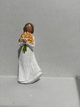 Woman Holding An Orange Bouquet of Flowers - $342.65 MXN