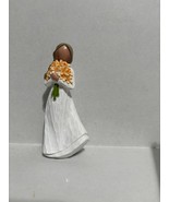 Woman Holding An Orange Bouquet of Flowers - $18.00