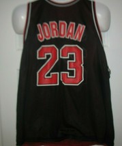 VTG Michael Jordan Chicago Bulls Black 23 Jersey Size XL 48 Champion Reversible - $84.14