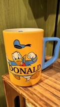 Walt Disney World Fiesty Donald Duck Yellow Blue White Ceramic Mug 14 oz NEW