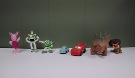 7 Disney Figurine Toy Lot: Piglet, Buzz Lightyear, Cars, Dinosaur, Jojos Circus - £3.91 GBP