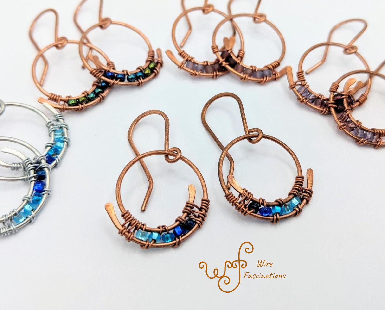 Handmade copper earrings: small spiral hoops wire wrapped with glass beads - $27.00