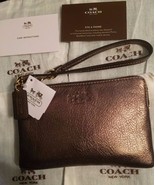COACH Authentic Bleeker Metallic Gold Pebbled Leather Small L-Zip Wristl... - $747.53 MXN