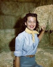 Gail Russell smiling portrait in blue shirt sits on bale of hay Poster 4... - $131.20 MXN