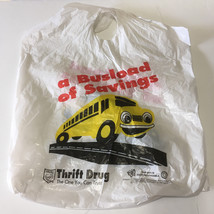 Defunct Thrift drug store plastic bag a busload of savings yellow bus graphics - $19.75