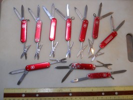 lot of 10 Victorinox Companion Swiss Army knife in red alox- all need work - $41.83