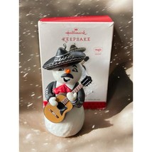 Hallmark Ornament Feliz Navidad Spanish Snowman Sings in box Keepsake - $14.96