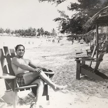 Man on beach posing Adirondack chair palm tree Found Black and White Photo - £6.36 GBP