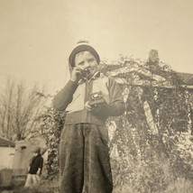 Found B&amp;W Photo Young Boy Playing With Telephone Outside Winter Hat - £7.07 GBP