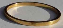 Coach Gold Tone Bangle Unisex Bracelet in Excellent Condition - $31.00
