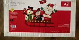 Christmas lighted display Pre-Lit Holiday Santa Sledding With Friends, 42&quot; - $395.99