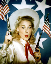 Betty Hutton in Annie Get Your Gun posing with guns and flags 16x20 Canvas - £54.98 GBP