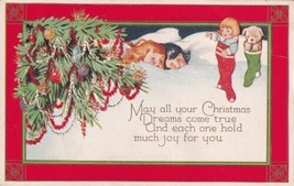 Christmas Sleeping Children Dreaming of the Toys in their Stockings Postcard D57 - $2.99