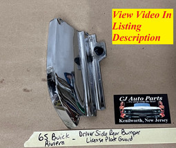 OEM 65 Buick Riviera LEFT DRIVER SIDE REAR BUMPER LICENSE PLATE GUARD SU... - $98.99