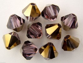 5 6mm Swarovski Crystal Bicones - Lt. Amethyst Dorado(Pls. read item descrip.) - £0.93 GBP