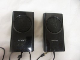 Sony speaker system and charger 4"x2" each speaker - $14.84