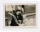 Eva and Wee Peter in Stroller in Front of Optician Shop Photograph - $13.86