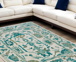 8' X 10' Green and Ivory Wool Floral Hand Knotted Area Rug With Fringe - $42,224.14 MXN