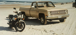 Vintage 1980s Suzuki Motorcycle Photograph Parked On Beach Chevrolet Pickup - $11.99